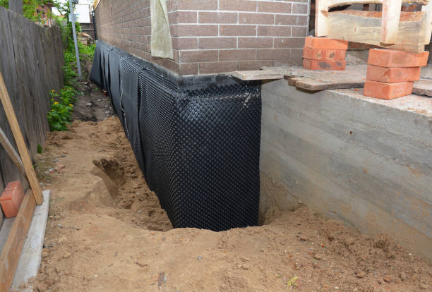 SJ Waterproofing Pros technician performing targeted Interior Drainage System assessment in Stephenson, VA